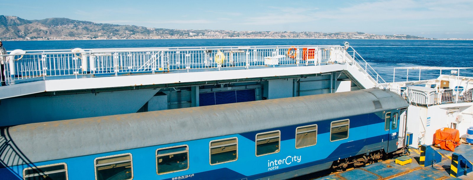 Intercity Notte sleeper train crossing the Strait of Messina by ferry